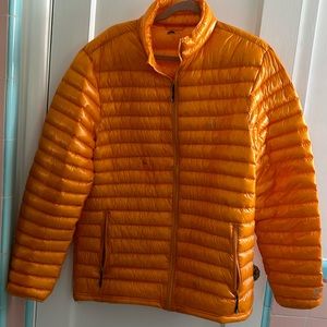 GoLITE, bright orange puffer jacket perfect for snow